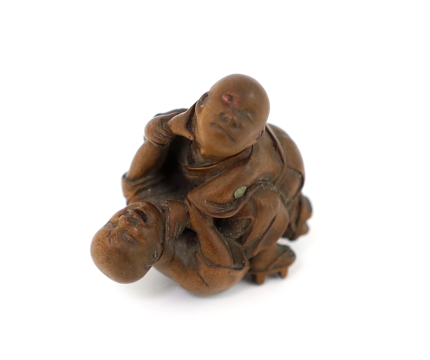 A Tokyo School carved wood netsuke of two boys fighting, 19th century, signed Kakiman